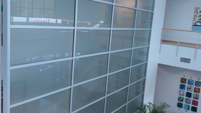 tall office wall with glass decor